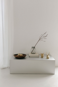 Tealight Holders in brass with patina finish on table with interior details
