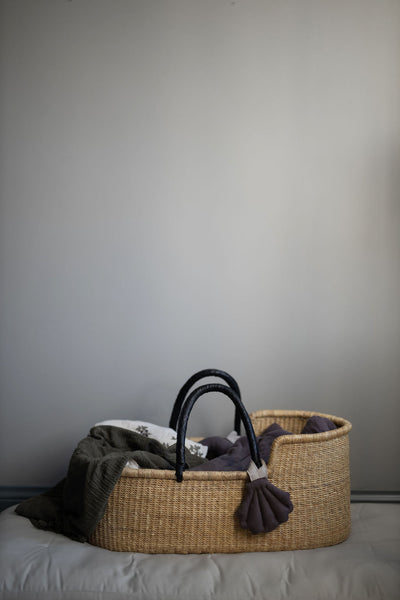 Shell Charm Hanger in recycled linen hanging from baby basket