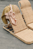 Thin Beach Blanket laying on sunbed backrest