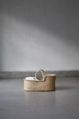Baby Basket in Ecru hypoallergenic mattress in undyed grass on floor