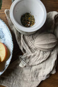 The Straw Kitchen Muslin Cloth next to bowl with apples