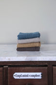 Baby Swaddle blankets stacked with four colors and organic natural materials