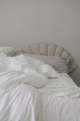 Shell Mattress Medium  used as headboard with white sheets