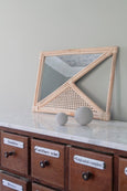 Squared Rattan Mirror on dresser with candles holders