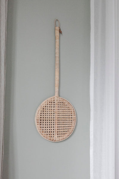 Carpet Beater in Rattan hanging on wall