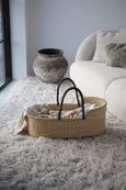 Handmade Baby Basket Natural with Leather Handle on furry carpet